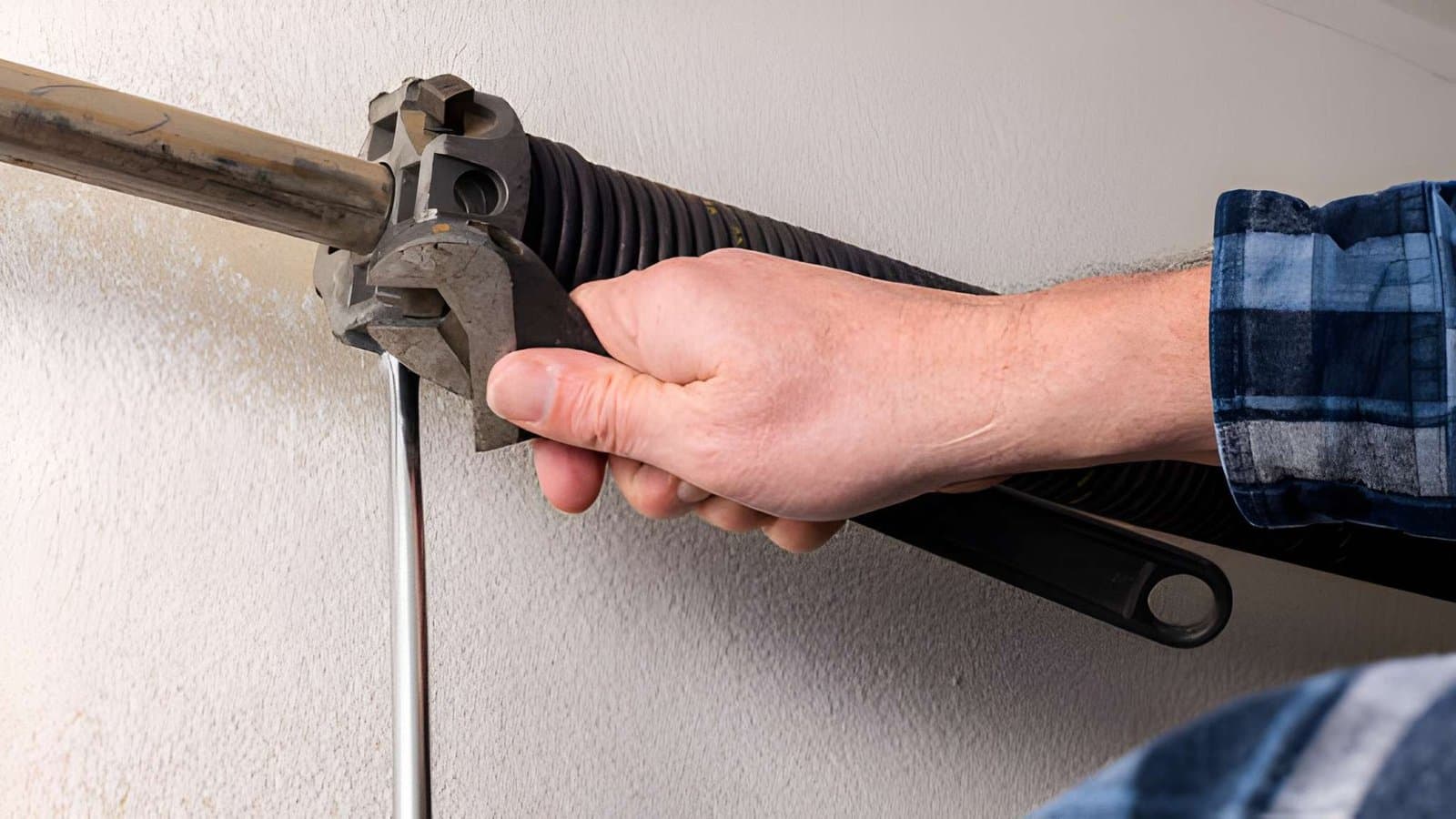 Technician replacing garage door spring in Melbourne